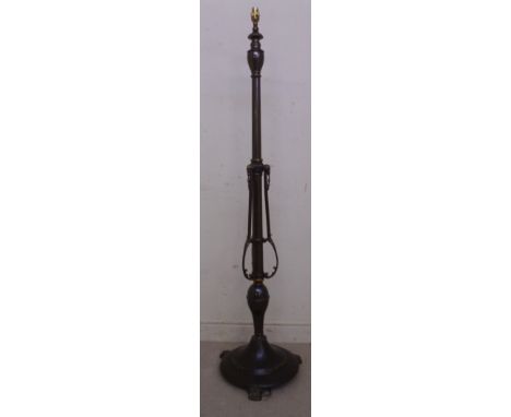 An early 20thC anodised steel, copper and brass lamp standard of neo-classical design, the knopped column with rams' head orn