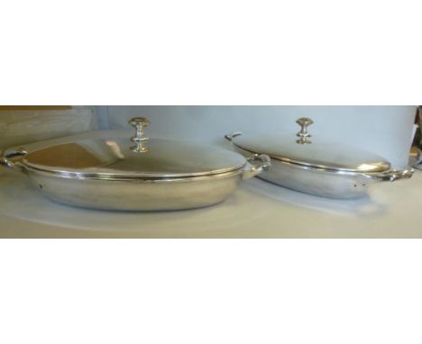 A pair of W A S Benson silver plated oval tureens, having twin opposing handles, a domed cover and knopped finial  12''w 