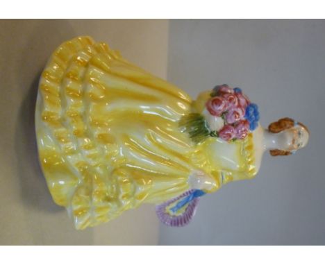 A Royal Worcester china figure 'June'  No.2096, modelled by Sybil V Williams and Jessamine S Bray, wearing a yellow dress  4.