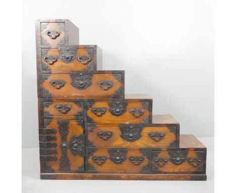A Japanese two section Kaiden Tansu step chest of eight drawers with single cupboard. 127x120.5x40cm.Generally good condition