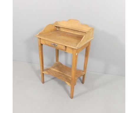 A light oak two-tier wash stand, with raised back and single drawer. 59x90x44cm.