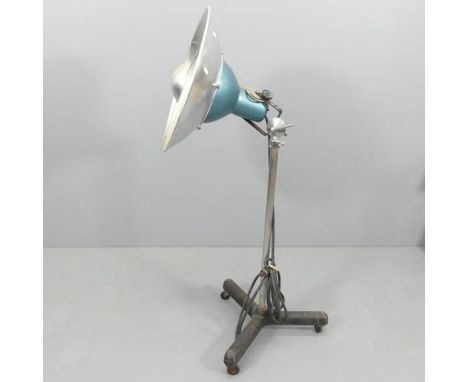 A vintage industrial studio lamp, on telescopic stand with tripod base. Labelled for Professional Cameras Limited. Max Height