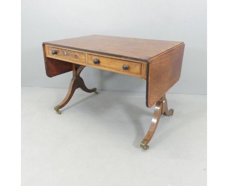 A Regency mahogany crossbanded and ebony strung sofa table, with 2 drawers and arched stretcher. 98x69x65cm. 