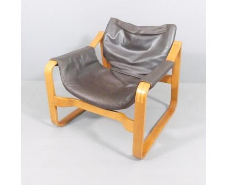 Maurice Prentice Burke, a rare leather lounge chair, the beech frame with sled base, with maker’s label, possibly a developme