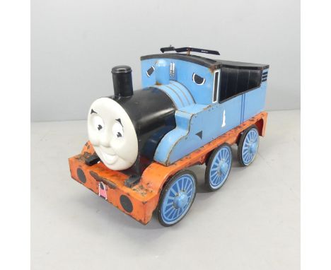 A Thomas the Tank Engine pedal car. 86x57x42cm.Has been left outside, and is showing some rust. Steering wheel missing and ha