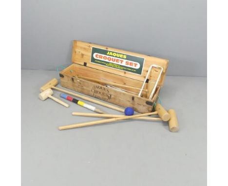 A Jaques four person croquet set in pine case. Case dimensions 110x20x27cm. 