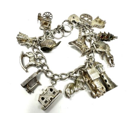 Vintage silver charm bracelet with opening charms weight 80g 