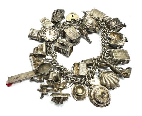 heavy vintage silver charm bracelet includes opening charms weight 108g 
