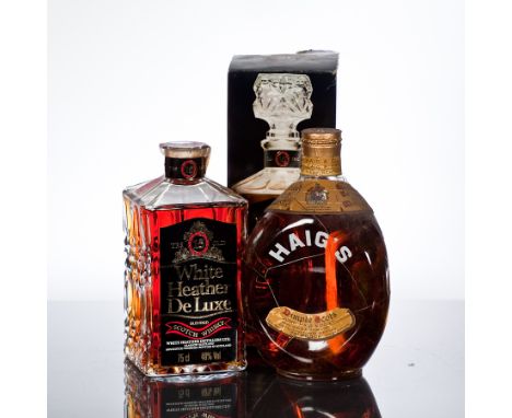HAIG'S DIMPLE
Blended Scotch Whisky with clasp seal. Full bottle size, no capacity stated, 70° Proof.
WHITE HEATHER DE LUXE
B