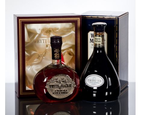 WHYTE & MACKAY TRIBUTE - ROBERT BURNS
Blended Scotch Whisky, aged 15 Years. Hand bottled in blue Wade ceramic decanter. 75cl,