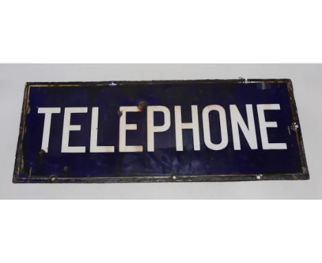 A rectangular enamel double sided ‘telephone’ sign, 56cm x 23cm