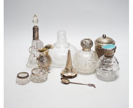 Sundry items including a German 800 white metal cream jug, three mounted glass scent bottles including silver and enamel, Ind