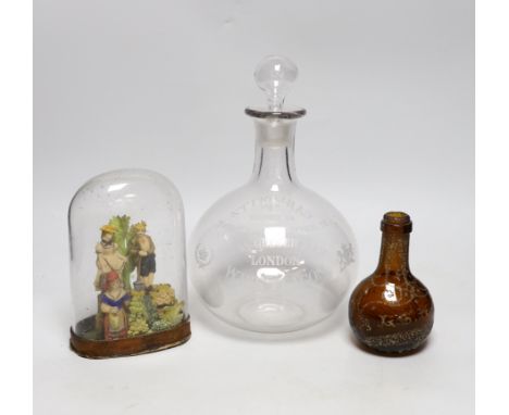 A large engraved, “Max Greger &amp; Co London Wine Flagon”, a small amber glass bottle 1891 and a figural wax sculpture under