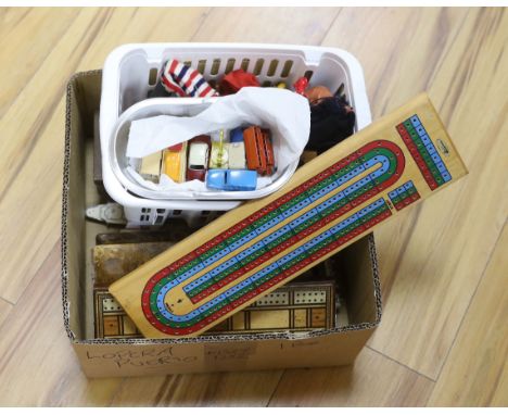 A quantity of toys including Dinky, Pelham puppet and cribbage board, the largest 38cm wide