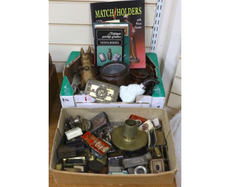 A collection of Vesta boxes, matchbox holders and other related ephemera, mostly metal examples, some with enamel panels, can