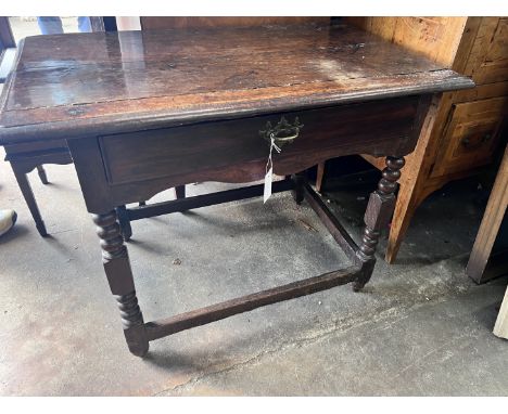 A 17th century oak side table, with bobbin turned legs, width 94cm, depth 54cm, height 69cm