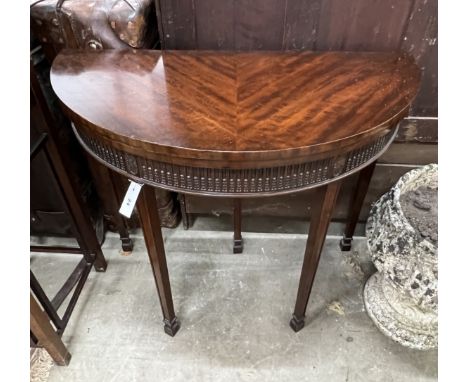 A Chippendale revival mahogany demi lune folding card table, width 92cm, depth 46cm, height 77cm