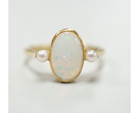 An 18ct, white opal and cultured pearl set three stone ring, size M, gross weight 3.1 grams.