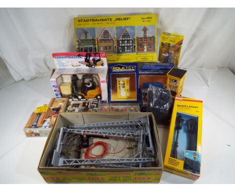 A box of G scale scenics to include street lamps, figures, telephone boxes, Cargo Master truck and similar  - This lot MUST b