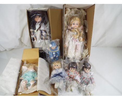 Dolls - a quantity of seven ceramic dressed dolls to include Ashton Drake Baby Doll, Alberon and similar all appear mint cond