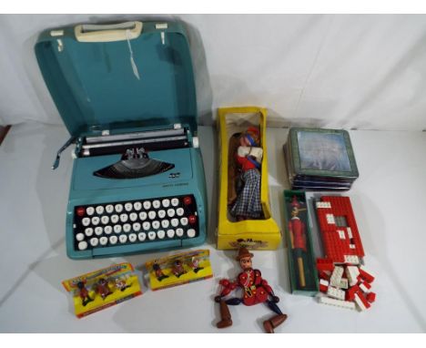 A good lot to include a vintage Pelham Puppet, SS Dutch Girl, two Britains new metal models set, five Harry Potter magna puzz