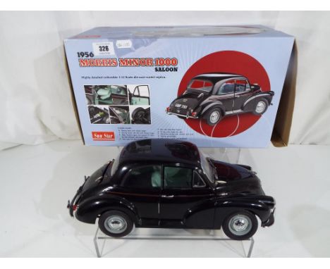 Sun Star - A diecast model of a 1956 Morris Minor 1000 Saloon in 1:12 scale, black body with green interior, produced in a li