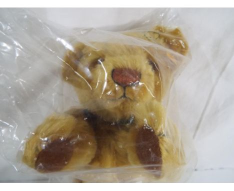 Steiff - a good quality Steiff teddy bear with button in the ear, original tags, in sealed original bag (mint condition)  - T