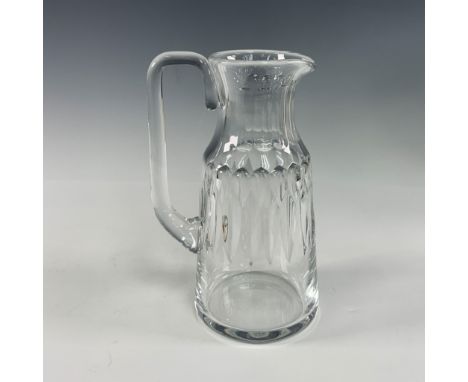 This exquisite crystal pitcher by Baccarat exemplifies the brand's unparalleled mastery in fine glassmaking. Featuring a beau