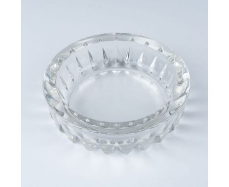 Elegant Italian crystal cut bowl featuring deep, geometric cuts along the sides and a thick, polished rim. The piece displays