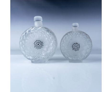 A pair of exquisite Lalique Dahlias perfume bottles, showcasing the brand's signature frosted and clear glass design. The bot