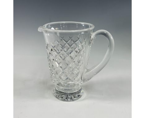 A stunning example of Waterford's renowned craftsmanship, this crystal pitcher features a classic diamond-cut pattern, embody