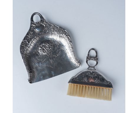 Stunning sterling silver crumb brush and dustpan set featuring intricate floral and scroll engravings. The brush is marked "9