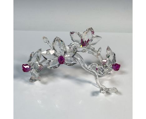 This retired silver crystal figurine of orchids were part of the In the Secret Garden collection. These four fully faceted or