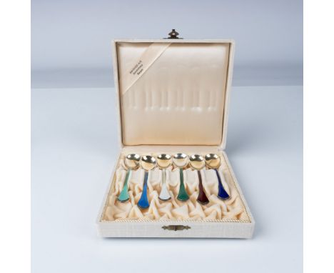 A set of six sterling silver cocktail spoons by K. Hestenes, Norway, featuring vibrant enamel accents in various colors. Each