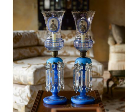 This exquisite lot features a pair of antique mantle lusters with intricate blue glass bases, adorned with fine enamel detail