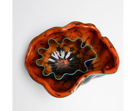 This striking handblown glass sculpture, titled "Ginger Plum Seaform," is a stunning example of Dale Chihuly's masterful glas