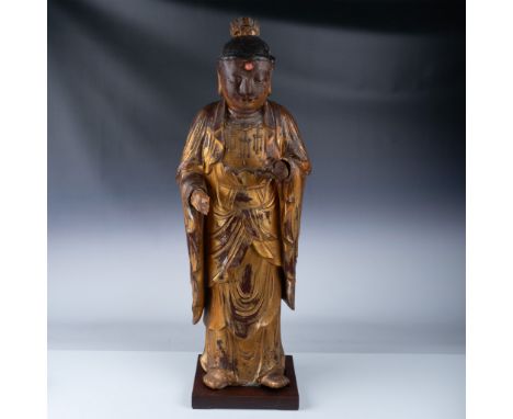 This exquisite Buddha statue is meticulously carved from wood, showcasing a polychrome finish that highlights intricate detai