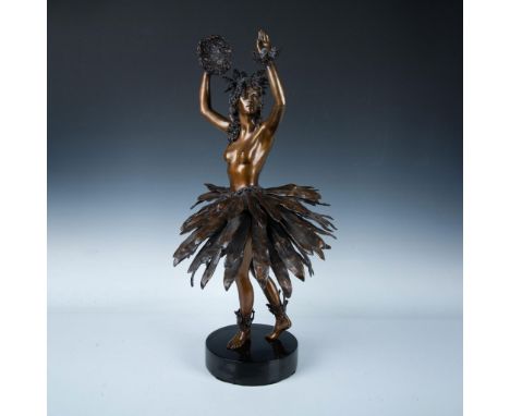 This stunning statue portrays a dancer in graceful motion, adorned with a leaf skirt and traditional headgear, her arms raise