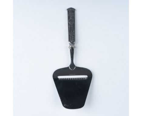 This is a vintage Norwegian cheese slicer, crafted with precision and featuring an intricately designed pewter handle adorned