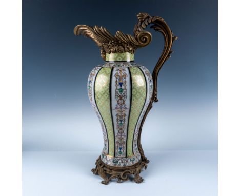 A magnificent United Wilson porcelain pitcher featuring intricate hand-painted floral motifs and decorative panels against a 