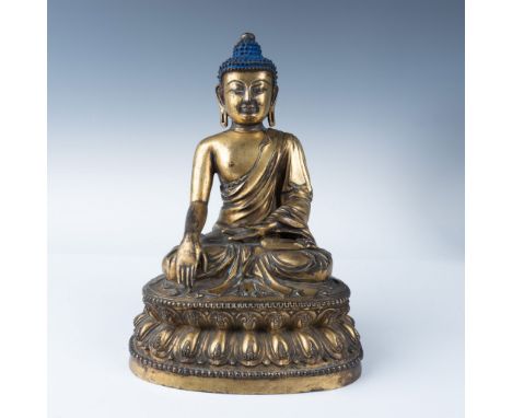 A stunning 15th-16th century Tibetan gilt bronze Buddha figure, embodying the spiritual and artistic brilliance of Himalayan 