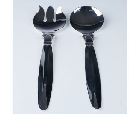 Refined silver-plated salad serving set, comprising a fork and spoon with a sleek modern design. The set is silver-plated wit