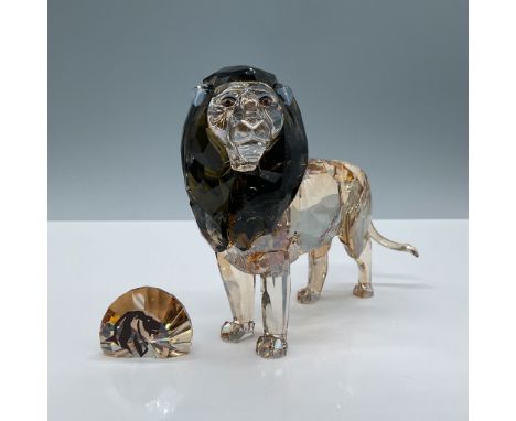 Expertly crafted faceted crystal figurine modeled as a proud male lion with light and dark brown coloration. Annual edition f