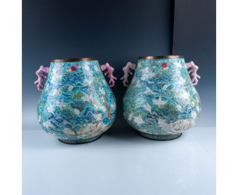 A remarkable pair of Chinese Famille Rose Canton enamel vases, exquisitely crafted with vibrant polychrome enamel applied ove