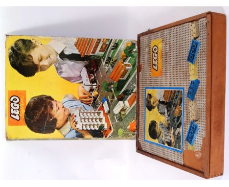 LEGO SYSTEM: An early vintage Lego System cased set of building bricks etc. Within the original wooden case, along with a sim