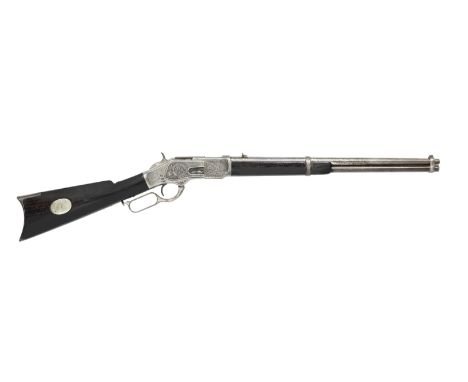 A deactivated .44-40 'Model 1873' lever-action saddle-ring carbine by Winchester, no. 15635 (dated 1877)With some moving part