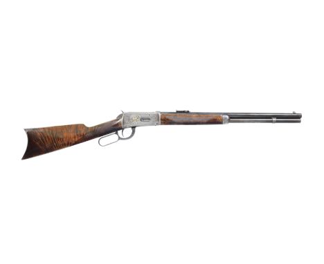 A .30 (W.C.F.) 'Model 1894' lever-action short rifle by Winchester, no. 122908The receiver engraved with bold foliate-scrollw