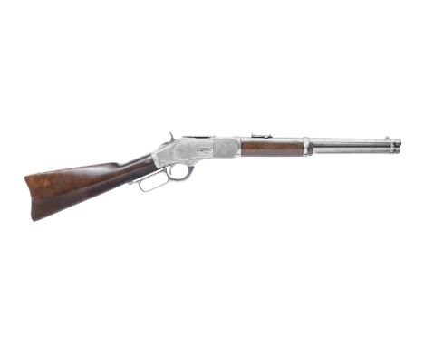A deactivated factory engraved .44(W.C.F.) 'Model 1873 Deluxe' lever-action saddle-ring trapper carbine by Winchester, no. 45