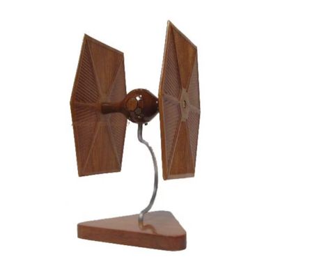 The TIE Fighter, an iconic starfighter from the "Star Wars" universe, is a symbol of the Galactic Empire's formidable militar