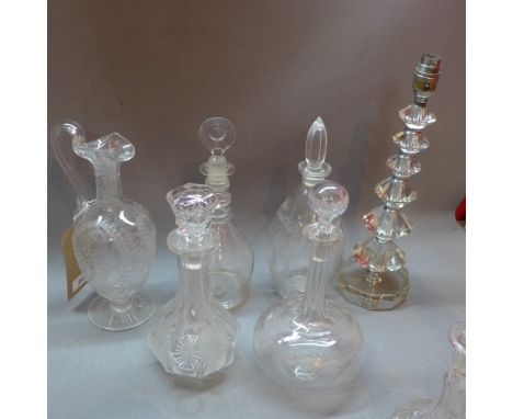 Five glass decanter with acid etched designs and a glass lamp.